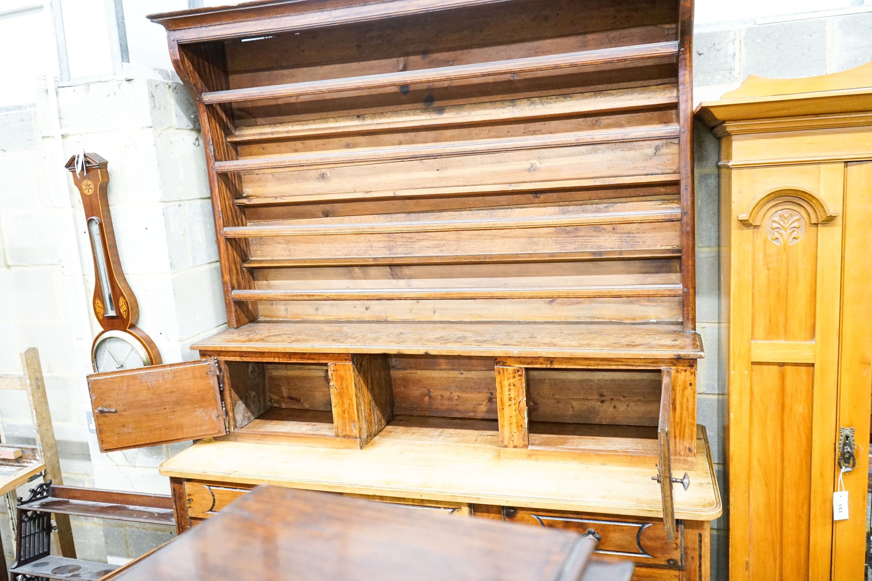 A late 18th / early 19th century French fruitwood dresser, length 160cm, depth 57cm, height 240cm